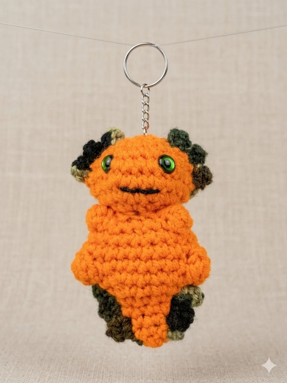 Handmade Orange Crochet Keychain Plush with Green Accents